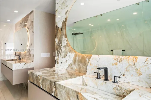a bathroom with a double vanity sink mirror and