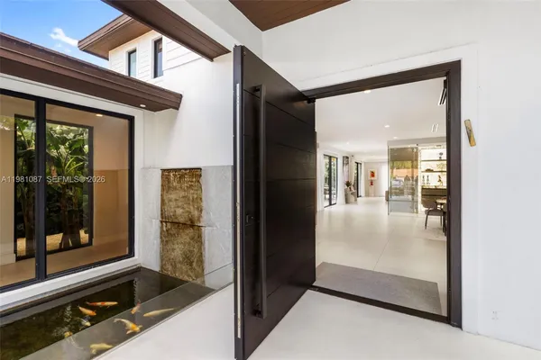 a view of a hallway with living room
