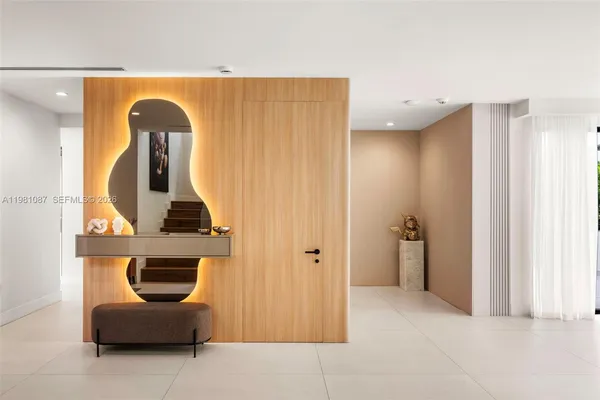 a view of living room with furniture and wooden floor