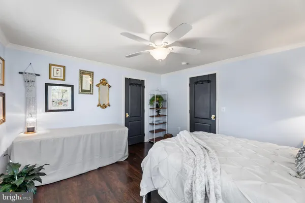 a view of a hallway with a white walls and a window