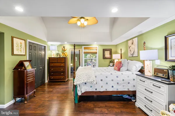 a living room with furniture and a book shelf