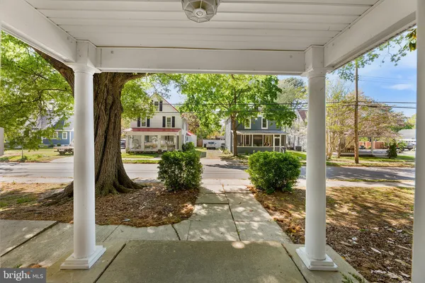 a view of a porch and garden