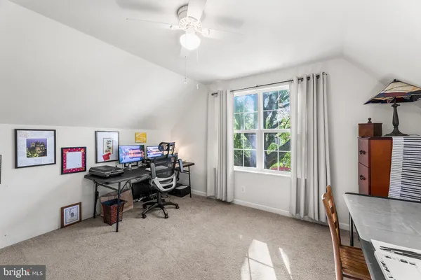 a kitchen with a table and chairs in it