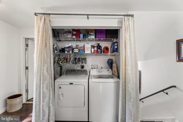 a room with furniture a flat screen tv and a book shelf