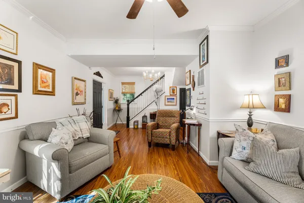 a kitchen with stainless steel appliances granite countertop a stove and chairs