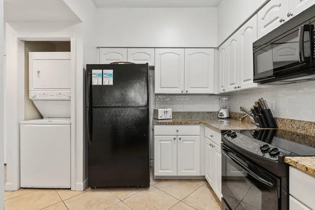 a kitchen with a stove microwave and refrigerator