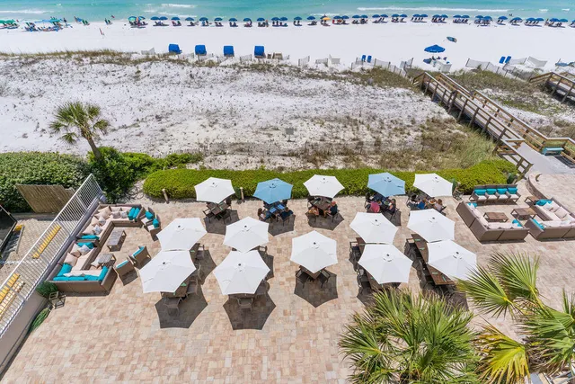 a view of open pool table and chairs in patio