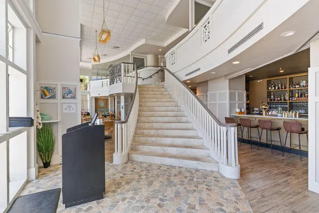 a view of a chairs and table in patio