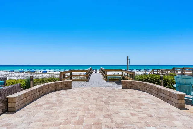 swimming pool view with a lounge chair