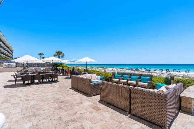 a view of a swimming pool and lounge chairs