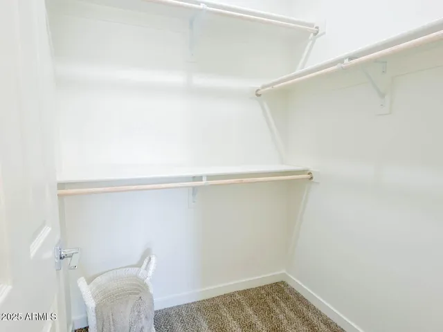 an empty room with closet area
