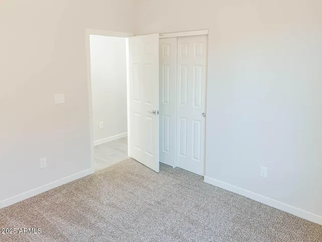 a bathroom with a toilet a sink a mirror a bathtub and vanity