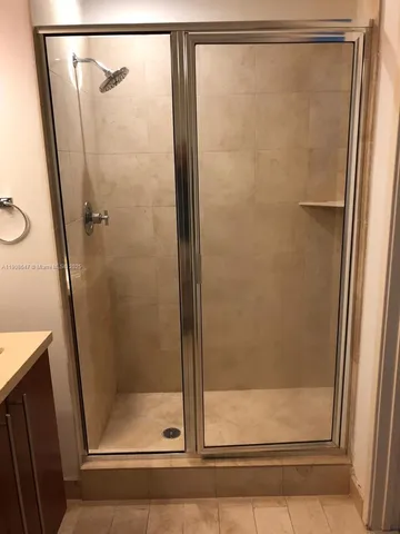 a bathroom with a toilet and a bathtub