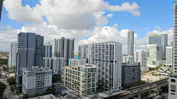 a view of city with tall buildings