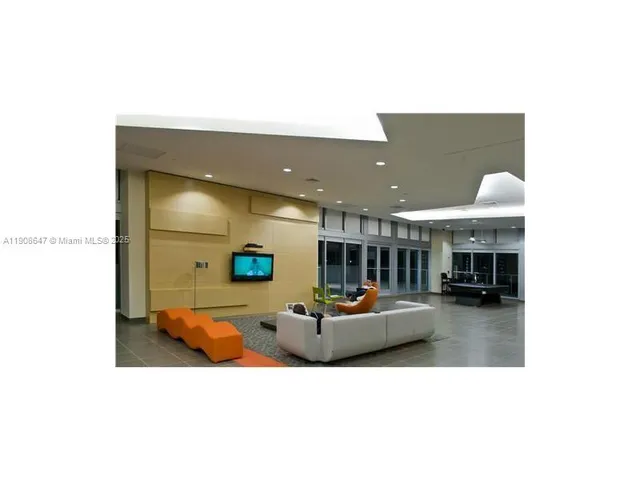 a view of swimming pool outdoor seating and city view