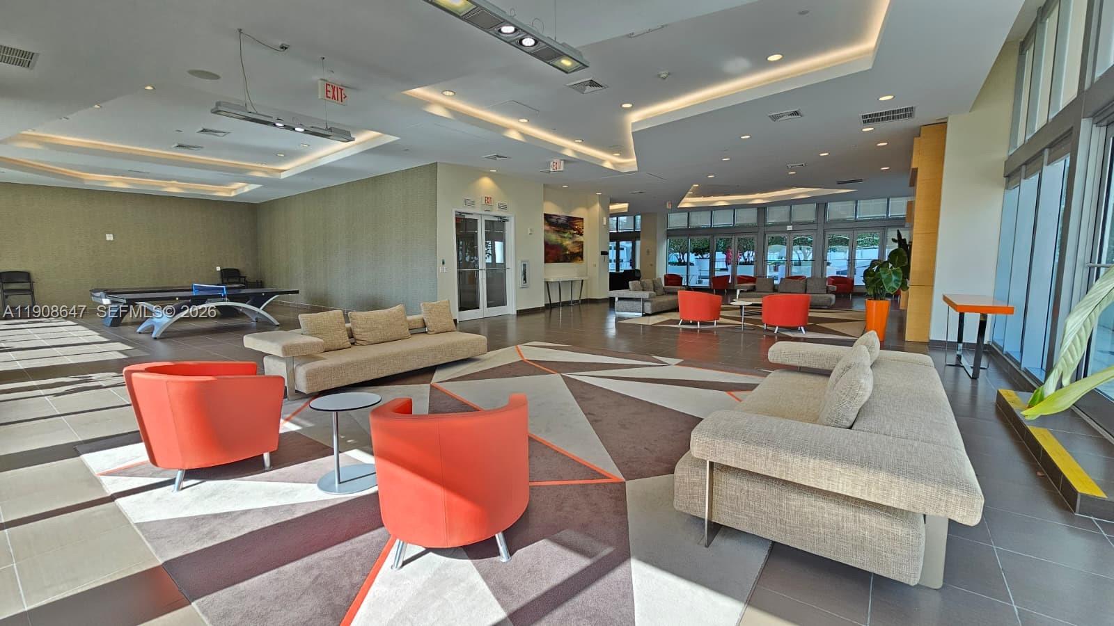 1111 Southwest 1st Avenue, Unit 2124N Miami, FL 33130 - Photo 21 of 34 a living room with lots of furniture and a table