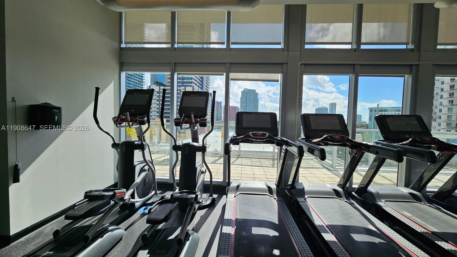 1111 Southwest 1st Avenue, Unit 2124N Miami, FL 33130 - Photo 30 of 34 a view of a room with gym equipment