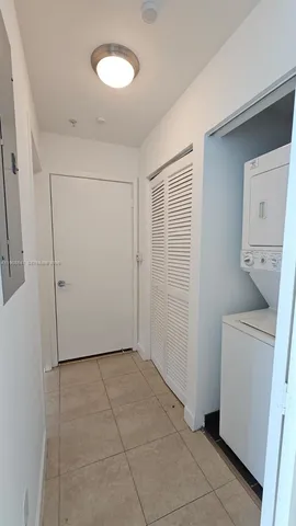 a view of a storage & utility room with a washer dryer