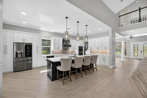 a bathroom with a toilet a sink a mirror and vanity
