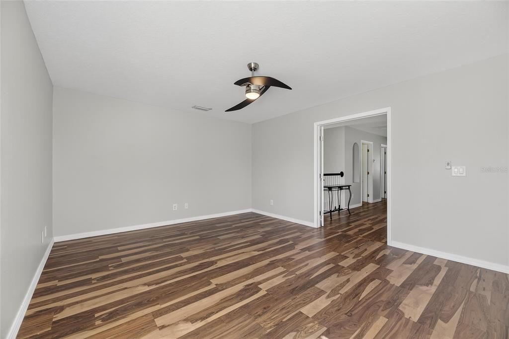4310 70th Avenue East Ellenton, FL 34222 - Photo 26 of 97 a view of an empty room with wooden floor