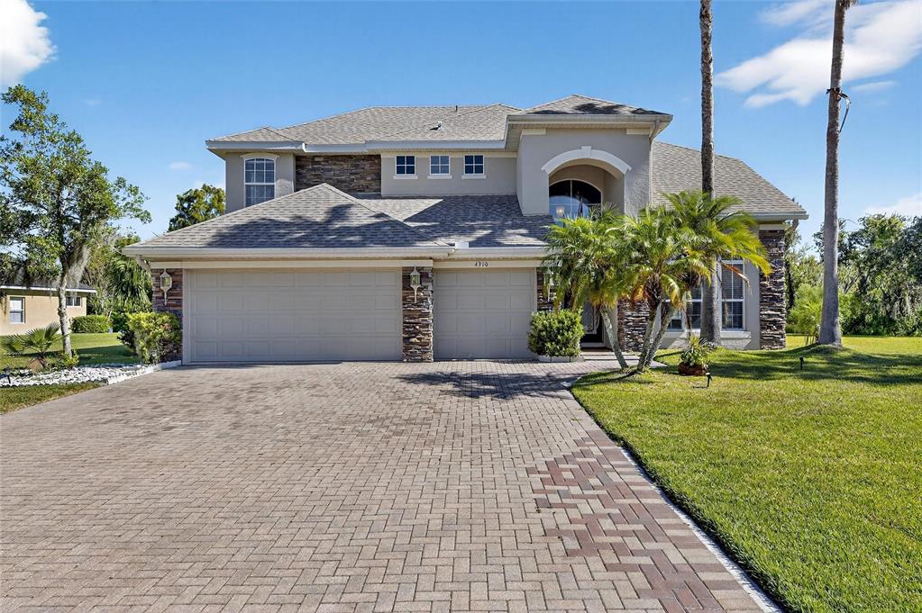 4310 70th Avenue East Ellenton, FL 34222 - Photo 4 of 97 a front view of a house with garden