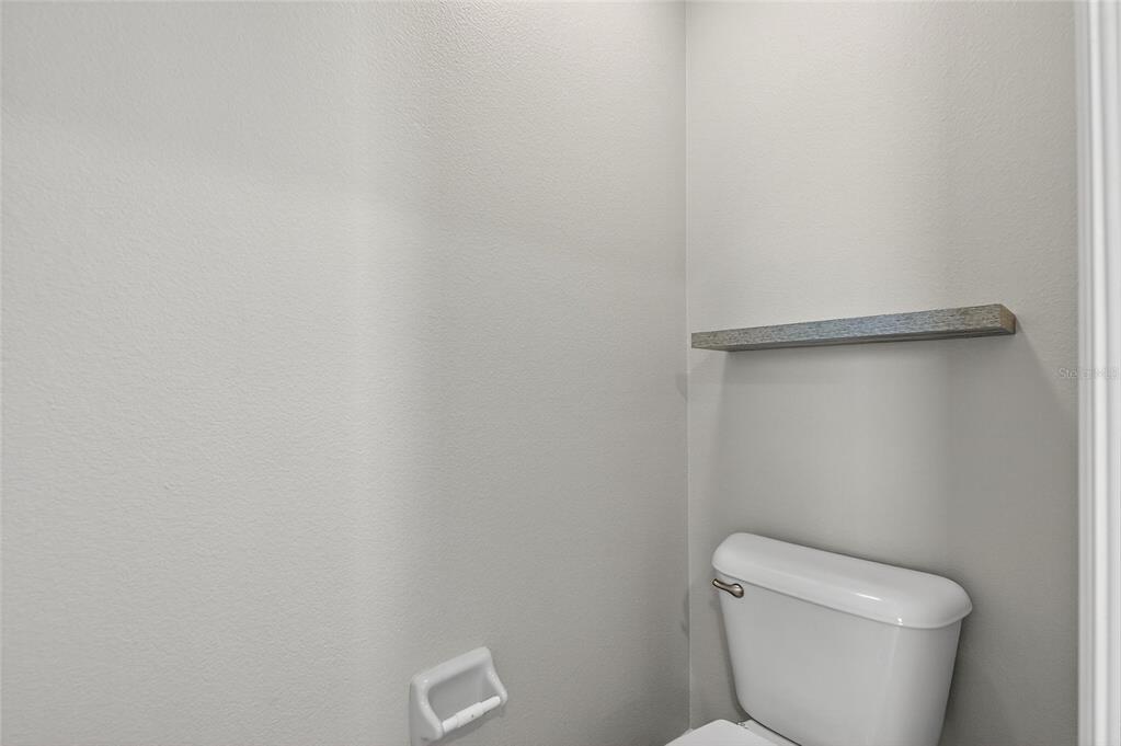 4310 70th Avenue East Ellenton, FL 34222 - Photo 41 of 97 a white toilet sitting next to a white wall