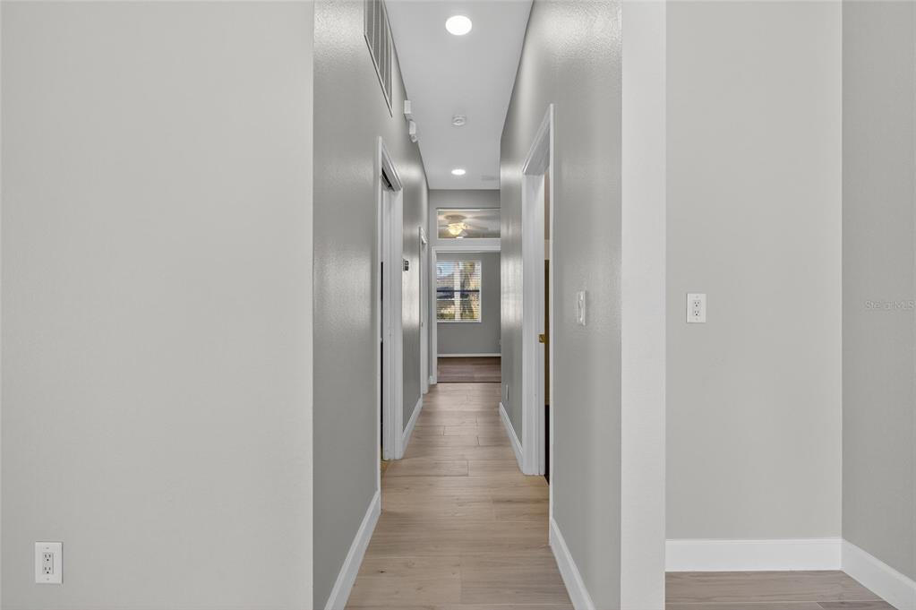4310 70th Avenue East Ellenton, FL 34222 - Photo 42 of 97 a view of a hallway with wooden shelves
