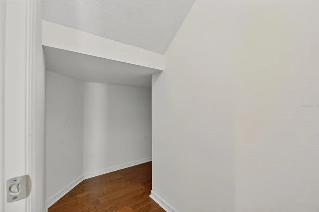 a view of a lake with boats and trees in the background