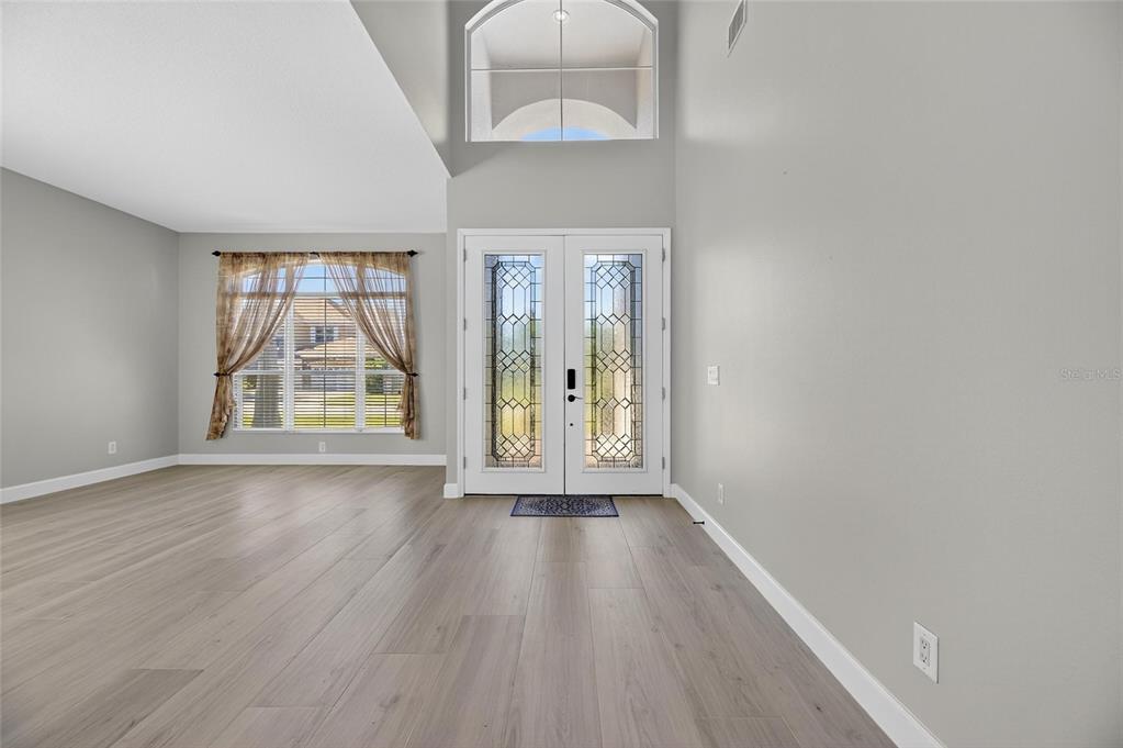 4310 70th Avenue East Ellenton, FL 34222 - Photo 53 of 97 wooden floor in an empty room with a window