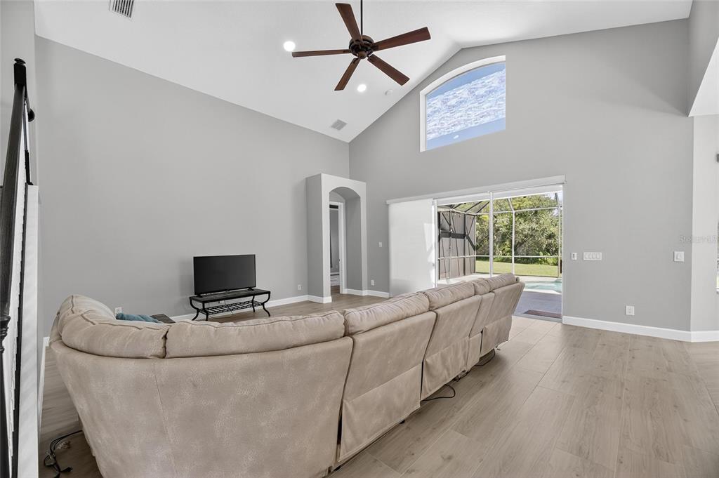 4310 70th Avenue East Ellenton, FL 34222 - Photo 63 of 97 a living room with furniture and a flat screen tv