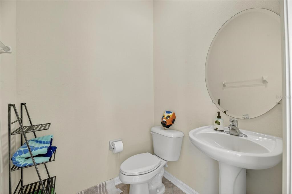 4310 70th Avenue East Ellenton, FL 34222 - Photo 79 of 97 a bathroom with a sink mirror and toilet