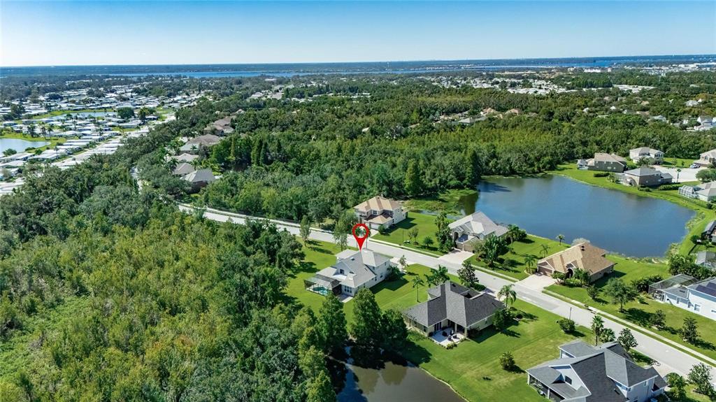 4310 70th Avenue East Ellenton, FL 34222 - Photo 93 of 97 an aerial view of residential houses with outdoor space and trees