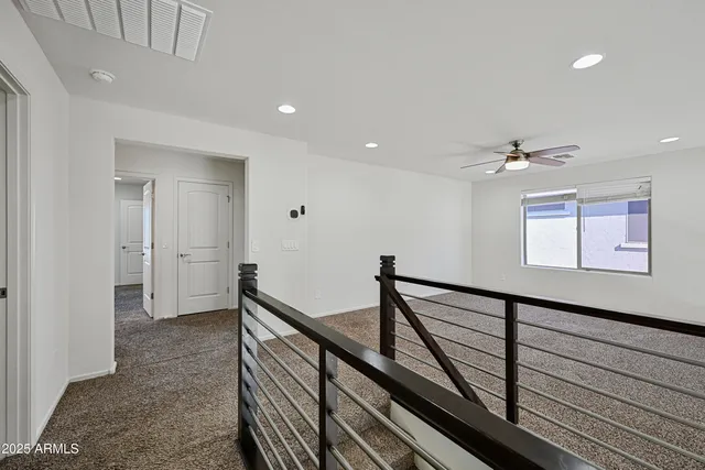 a view of a hallway with stairs