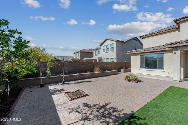 a view of swimming pool with outdoor seating and plants