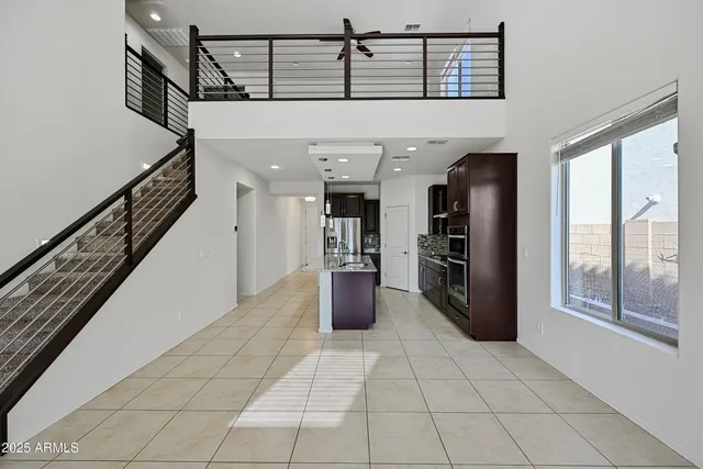 a view of a hallway with furniture