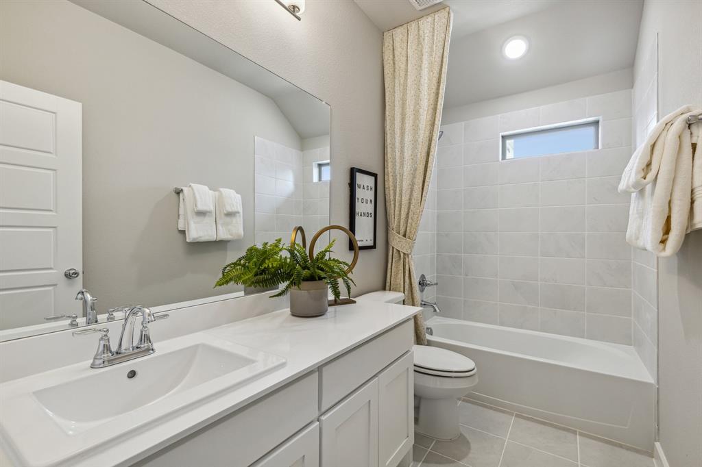 1129 Del Rio Drive Lavon, TX 75166 - Photo 25 of 28 Bathroom in the Wimbledon home plan by Trophy Signature Homes – REPRESENTATIVE PHOTO