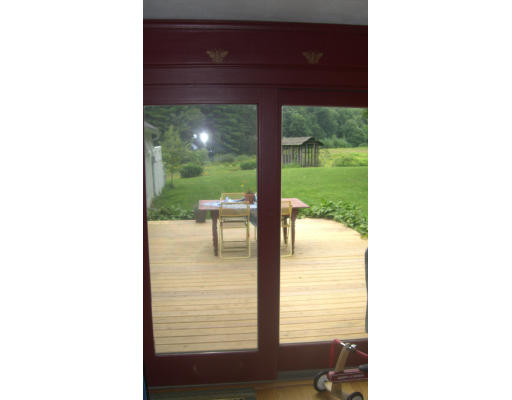 516 Westhampton Road Northampton, MA 01062 - Photo 26 of 29 a picture of a bench in front of a door