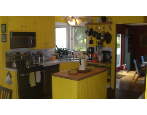 516 Westhampton Road Northampton, MA 01062 - Photo 8 of 29 a open kitchen with a table and chairs