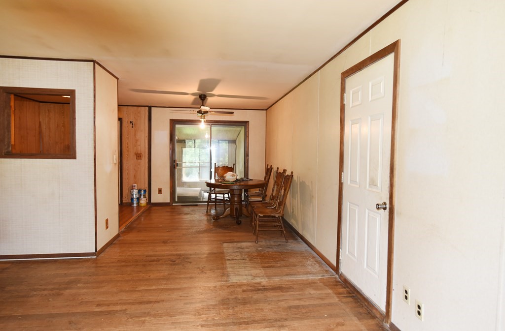 7 Gates Road Marshfield, MA 02050 - Photo 12 of 37 a view of a hallway with wooden floor and furniture