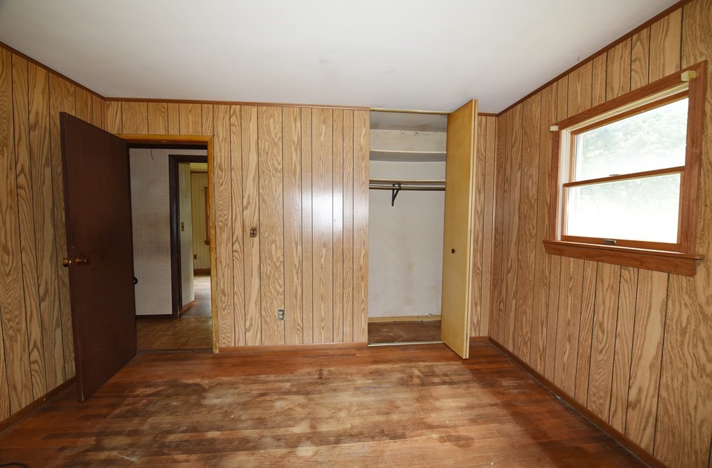 7 Gates Road Marshfield, MA 02050 - Photo 15 of 37 a view of an empty room with wooden floor and a window