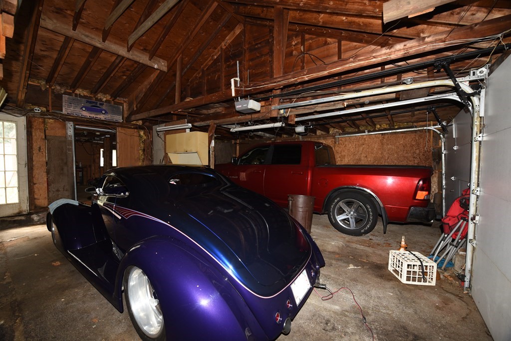 7 Gates Road Marshfield, MA 02050 - Photo 25 of 37 a car that is parked in a garage