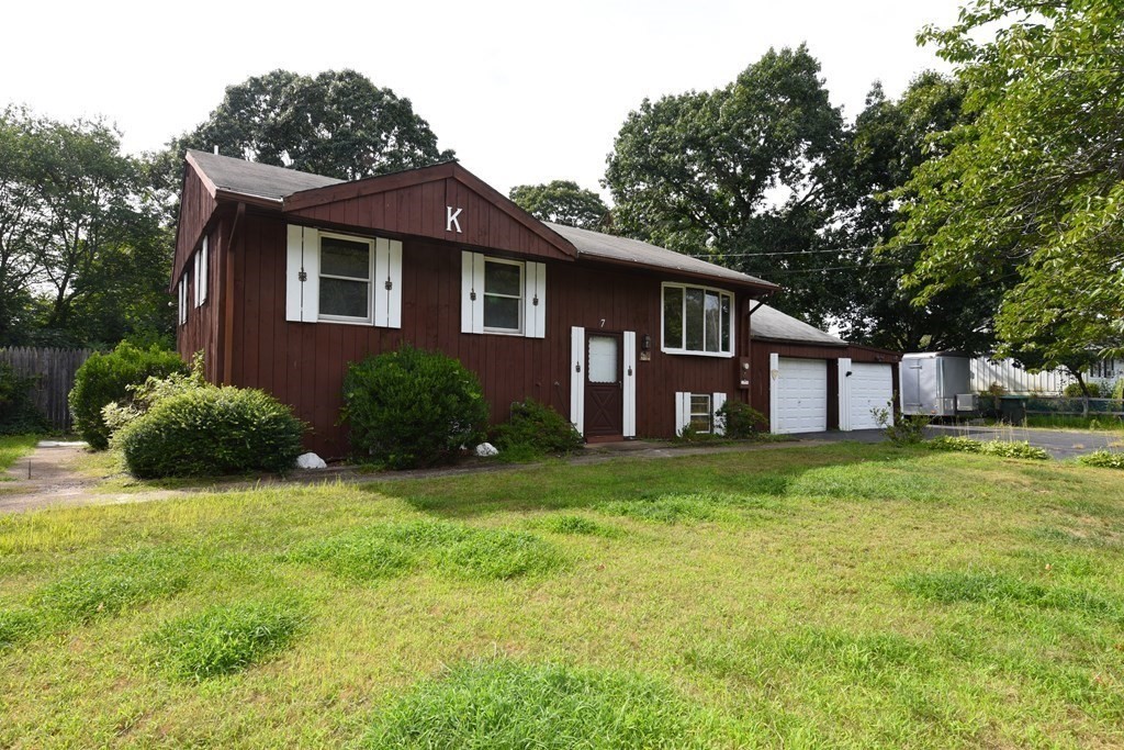 7 Gates Road Marshfield, MA 02050 - Photo 3 of 37 a front view of a house with a garden