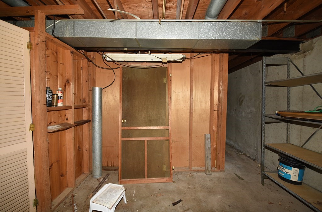 7 Gates Road Marshfield, MA 02050 - Photo 33 of 37 a room with water heater and a wooden door