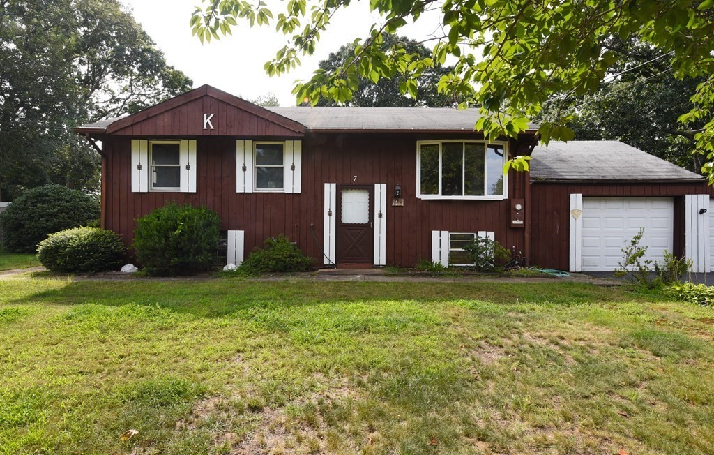 7 Gates Road Marshfield, MA 02050 - Photo 4 of 37 a front view of a house with a garden