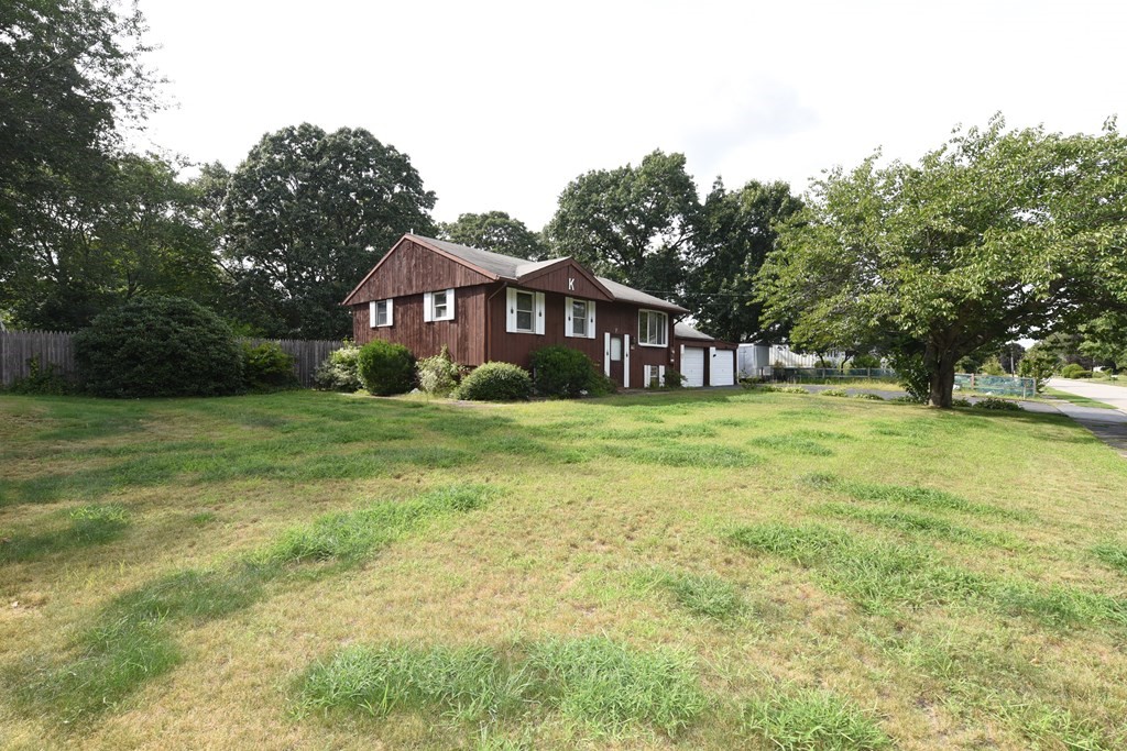 7 Gates Road Marshfield, MA 02050 - Photo 9 of 37 a view of a big house with a big yard and large trees
