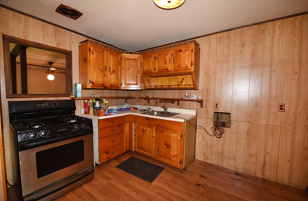 7 Gates Road Marshfield, MA 02050 - Photo 10 of 37 a kitchen with stainless steel appliances a stove and a refrigerator