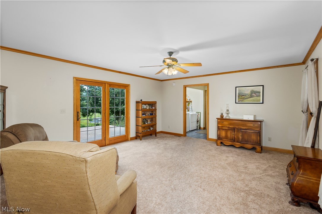 10909 Ruby Road Cambridge, OH 43725 - Photo 11 of 34 Sitting room featuring ornamental molding, light carpet, and ceiling fan