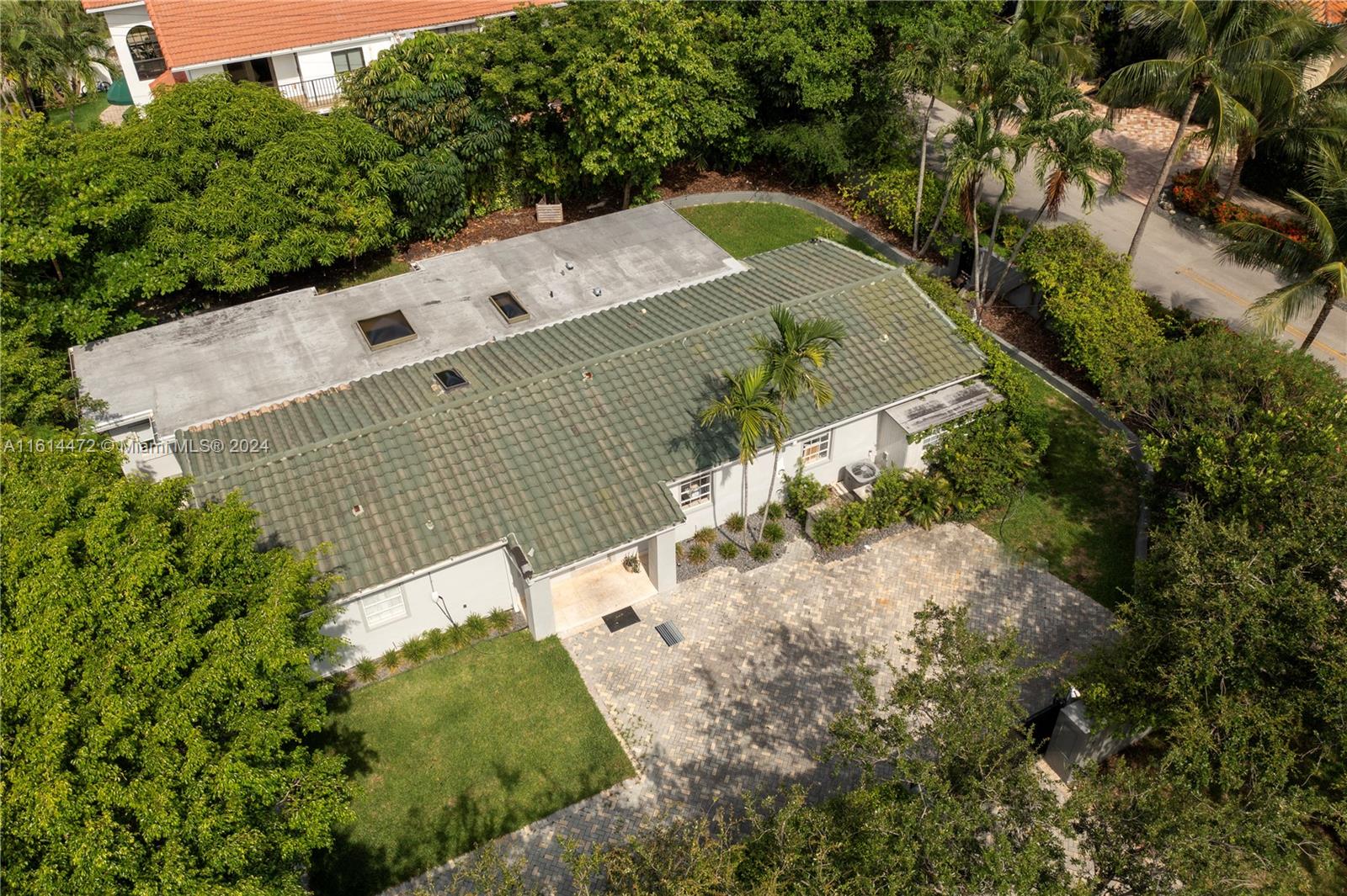 599 Glenridge Road Key Biscayne, FL 33149 - Photo 17 of 53 an aerial view of a house with a yard