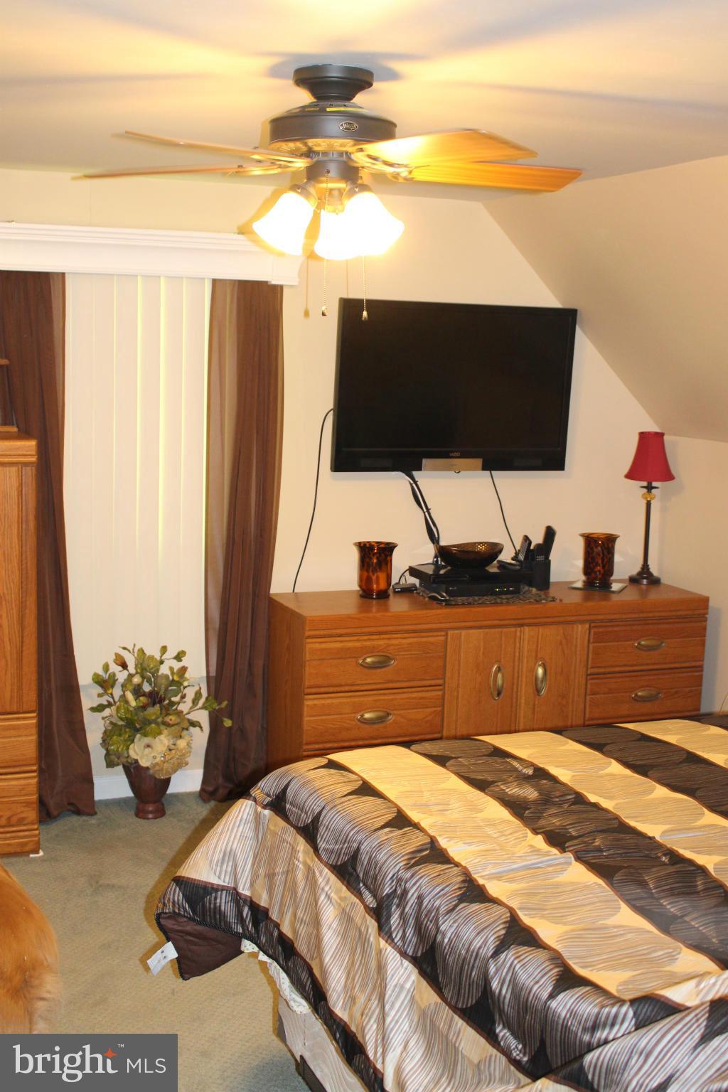330 Red Cloud Road Lusby, MD 20657 - Photo 29 of 30 a bedroom with a bed and window