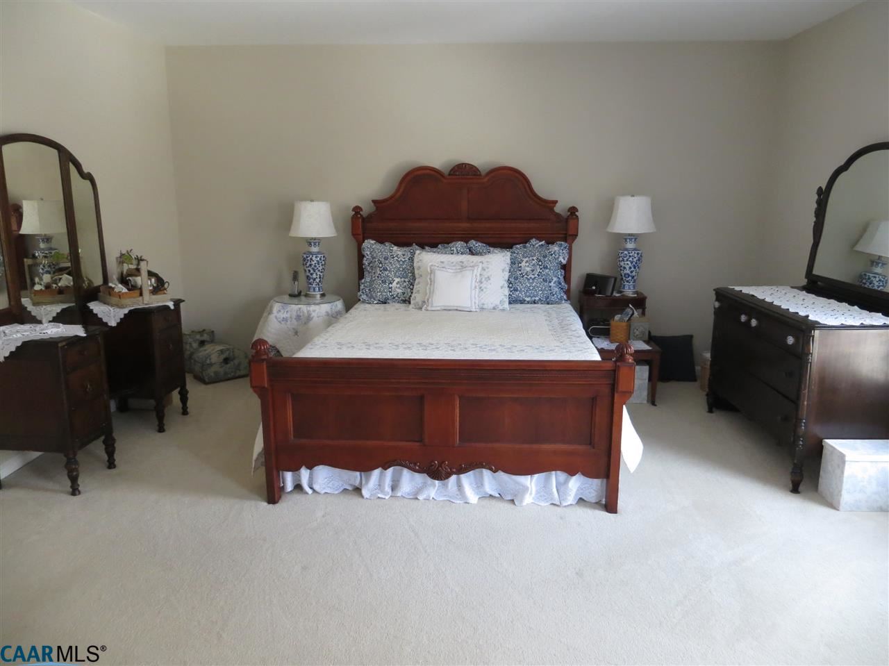 315 Grassmere Road Charlottesville, VA 22903 - Photo 12 of 32 a bed sitting in a room next to a fireplace